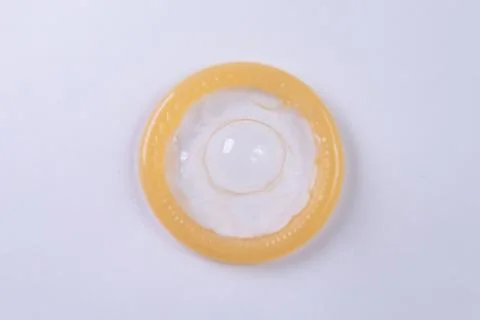 Latex condom on white background Stock Photos