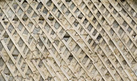 Lath of shingles for application of stucco on wall background texture Stock Photos