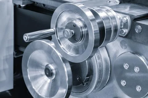 Lathe control knobs close up blue tone. Metal machine tools industry. The met Stock Photos