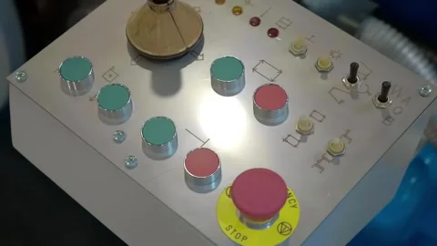 Lathe control panel with buttons, joystick, and emergency stop button  库存影片 333386473