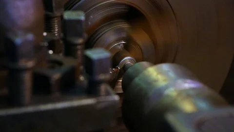 In a lathe, the cutter sharpens a metal part by cutting metal chips from it Stock Footage 128603785