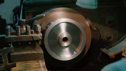 Lathe machine is cutting big blank metal disk. Metal shaving process. Stock Footage 115428234