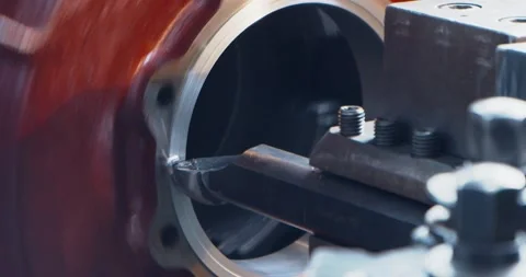 Lathe machine spinning and producing multiple metal shavings, slow motion Stock Footage 155116521