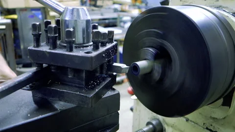 Lathe machine is working, turning pvc pipe Stock Footage 176486246