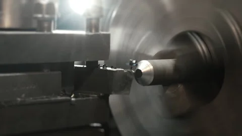 A lathe processes an iron workpiece in a workshop. Stock Footage 306540183