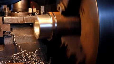 A lathe processes a metal workpiece close-up. Stock Footage 301453495