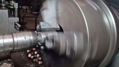 The lathe is rotating to create a workpiece from metal and thread. Stock Footage 330274562