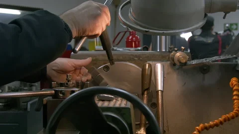 Lathe worker prepares the machine for work. Stock Footage 158754630