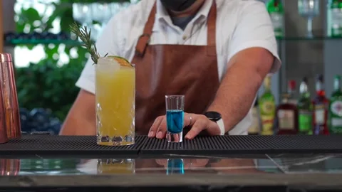 Latin bartender mexican at beach cocktail piña colada and blue shot Stock Footage 247969678