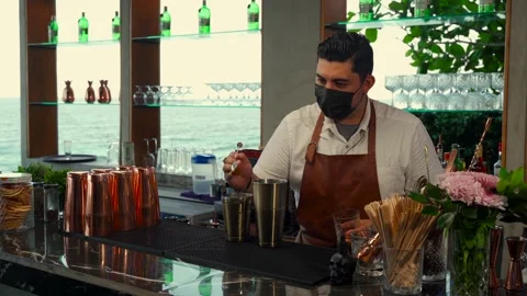 Latin bartender preparing milkshake coffee drink with ice cream at beach Stock Footage 248047788