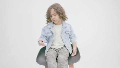 Latin boy in a sit waiting Stock Footage 245471484