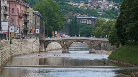 Latin Bridge Over Miljacka river, Sarajevo, Bosnia, Summer day, Tilt Up Vídeos de archivo 217372753