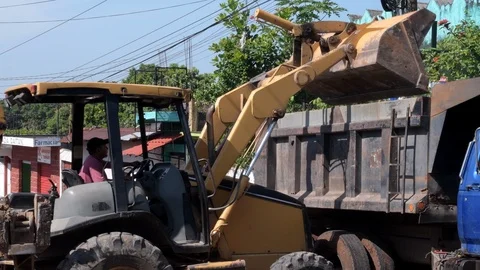 Latin bulldozer operator working on road construction in Guatemala Stock Footage 115795147