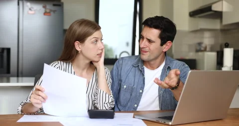 Latin couple feel concerned while calculating expenses Stock Footage 268626291