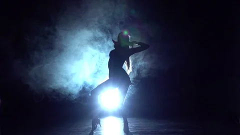 Latin dance in the studio, silhouette. Slow motion Stock Footage