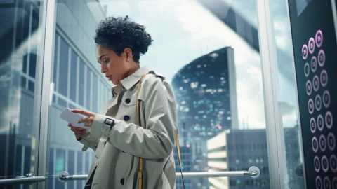 Latin Female Riding Elevator to Office 스톡 동영상 167556331