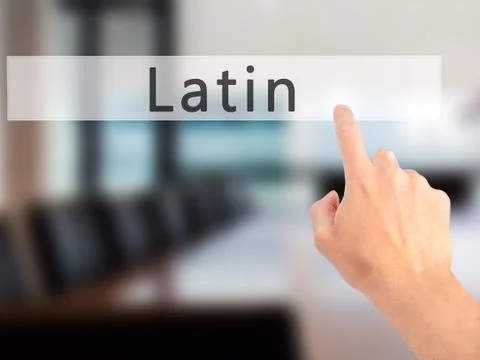 Latin - Hand pressing a button on blurred background concept on visual screen Stock Photos