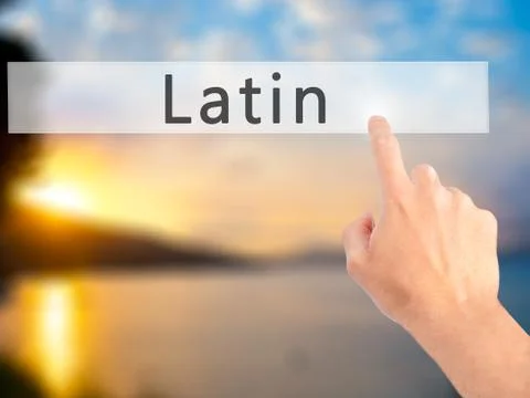 Latin - Hand pressing a button on blurred background concept on visual screen Stock Photos
