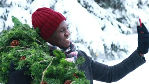 Latin hispanic man in red hat , scarf and stylish coat carrying eco reusable Stock Footage 221680710