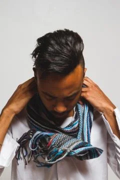 Latin man posing indoor over a grey wall. Stock Photos