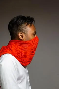 Latin man posing indoor over a grey wall. Stock Photos