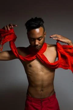 Latin man posing indoor over a grey wall. Stock Photos