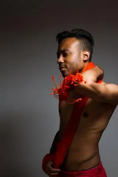 Latin man posing indoor over a grey wall. Stock Photos