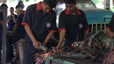 Latin mechanic students working on project together in Guatemalan college Stock Footage 116688218