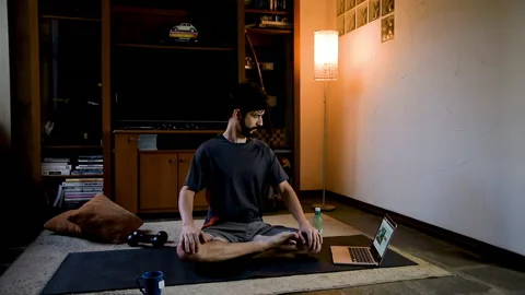Latin performing stretches during physical activity practices. Online fitness Stock Footage 130614674