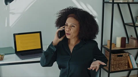 Latin Programmer Chatting on Phone while Coding on Laptop at Home Stock Footage 269018539