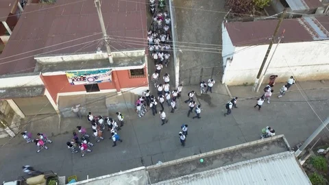 Latin students leaving school after the bell rings in Guatemalan village Stock Footage 110809458