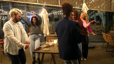 Latin woman dancing while partying with friends at roof bar Stock Footage 297351825