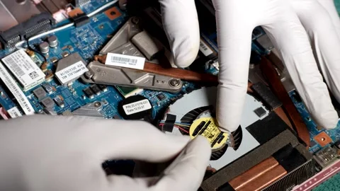 Latino Computer Technician Cleaning Laptop Processor Fan With Tweezers Stock Footage 176741389