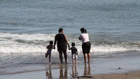Latino family at the beach Stock Footage