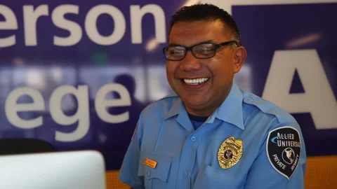 A Latino Security Guard Smiles Into The Camera Stock Footage 139891895