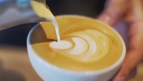 Latte art being made. Closeup video of coffee latte art making Stock Footage 300016050