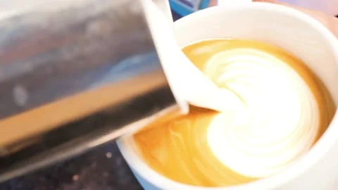 Latte art being made. Closeup video of coffee latte art making at cafe. Stock-Footage 334648481