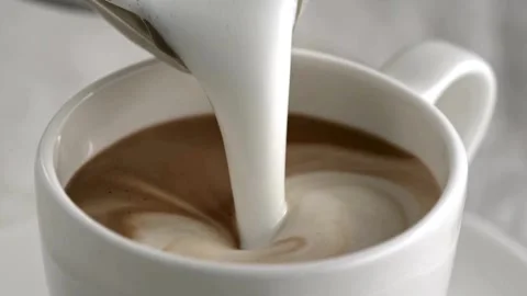 Latte art being made. Closeup video of coffee latte art making at cafe. Stock-Footage 334648576