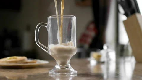 Latte being poured in kitchen (slow motion) Stock Footage 162673879