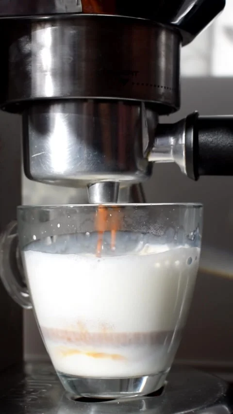Latte being prepared in espresso machine, close up coffee making process Stock Footage 331729156