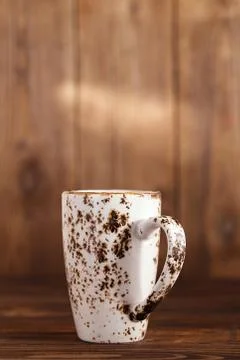 Latte coffee in rustic cup on old wooden backdrop Stock Photos
