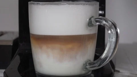 Latte. Espresso dissolving in milk Stock Footage 91488137