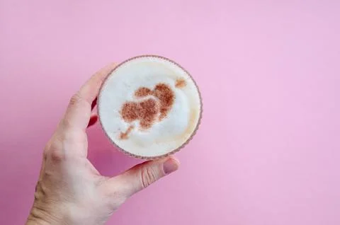 Latte mug with heart pattern, pink background, valentines day concept Stock Photos