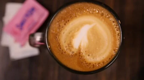 Latte with sugar packet Stock Footage