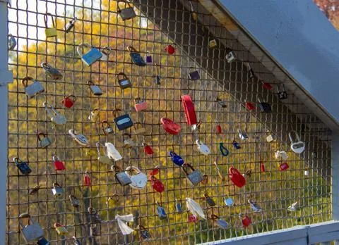 The lattice hung with locks of couples Stock Photos