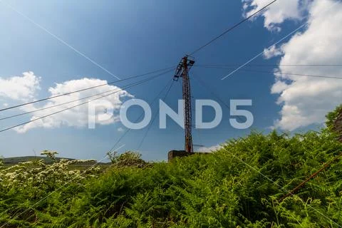 Lattice metal support tower for aerial cableway. Stock Photos