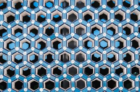 Lattice with pattern on ceramic tile window in Uzbek Islamic Mosque Minor in Stock Photos