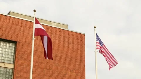 Latvian and US flags on the mast Stock Footage 247900778