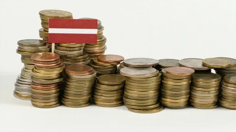 Latvian flag waving with stack of money coins Stock Footage 71976602