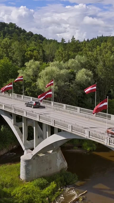 Latvian Flags Lining Bridge Over Gauja River Near Sigulda 動画素材 345095233